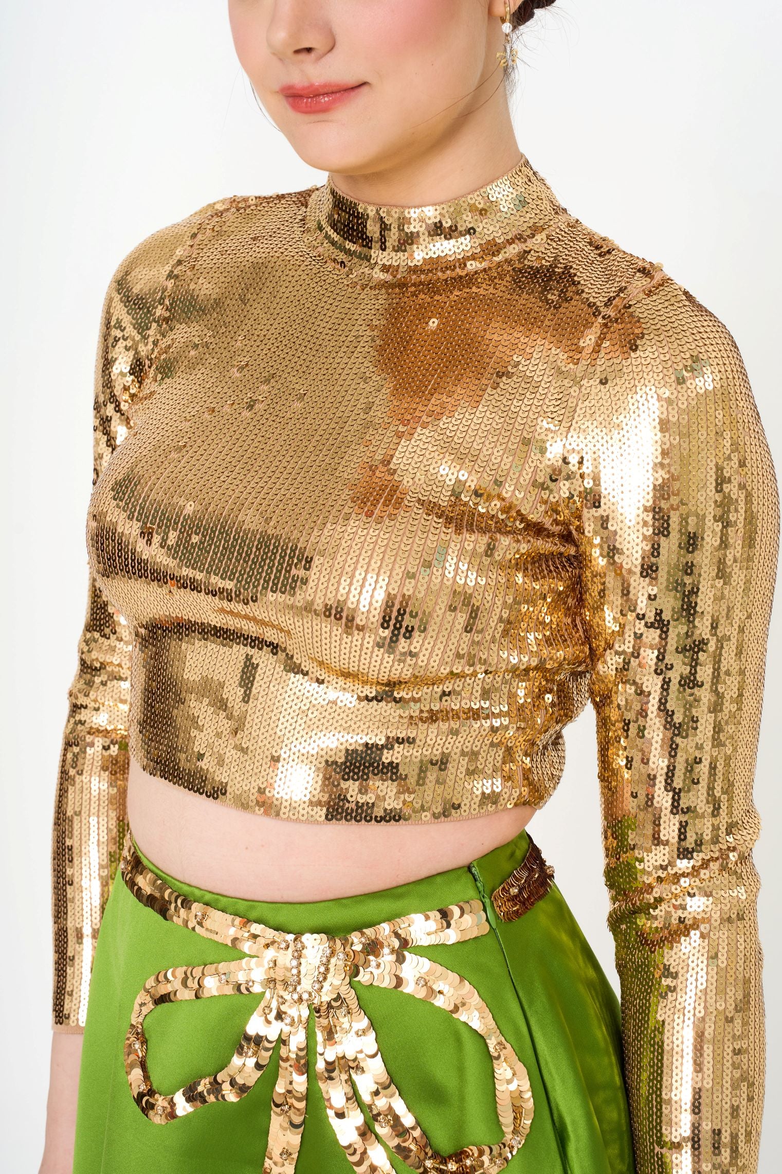 Close-up detail of the intricate sequin ribbon pattern on the Valentino skirt, highlighting the texture and luxurious sheen.